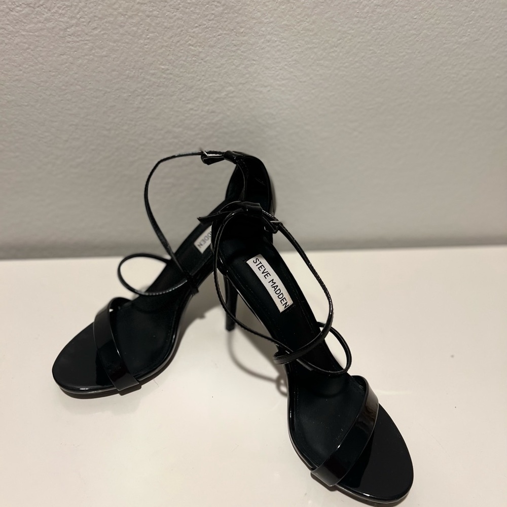 Glossy black cris cross heels